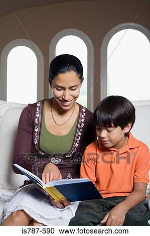 Stock Image - Woman and boy reading. Fotosearch