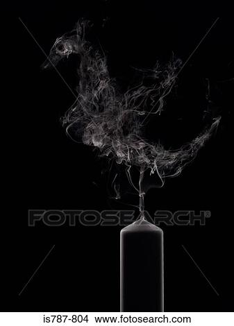 Picture - Dragon appearing in candle smoke. Fotosearch