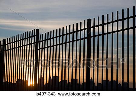 Stock Image - New york skyline through a fence. Fotosearch