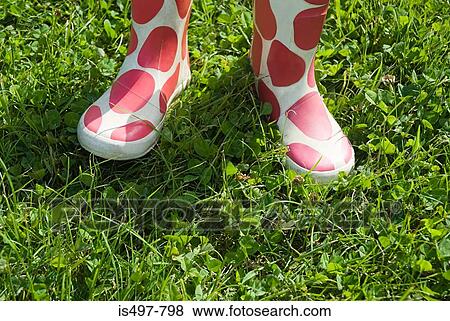 Stock Photo - A person wearing rubber boots. Fotosearch