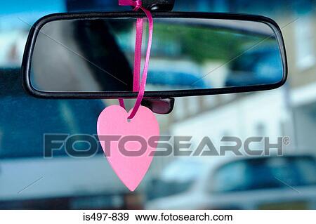 Stock Photo - A trinket hanging on a rearview mirror. Fotosearch