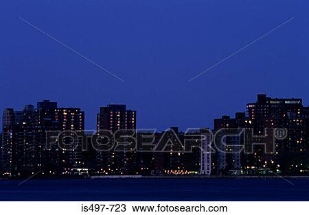 Apartment buildings next to a river View Large Photo Image Stock Image - Apartment buildings next to a river. Fotosearch