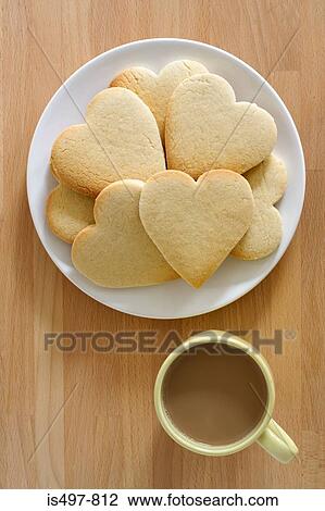 Heart shape biscuits and a cup of tea View Large Photo Image Stock Image - Heart shape biscuits and a cup of tea. Fotosearch