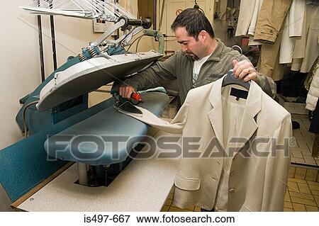 Man ironing jacket View Large Photo Image Stock Photo - Man ironing jacket. Fotosearch