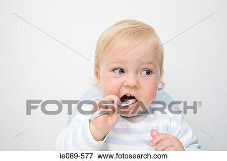 A baby boy brushing his teeth View Large Photo Image Stock Photo - A baby boy brushing his teeth. Fotosearch