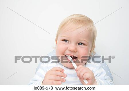 A baby boy brushing his teeth View Large Photo Image Stock Photo - A baby boy brushing his teeth. Fotosearch