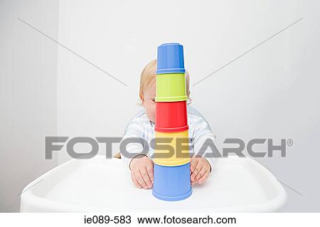A baby boy playing with building blocks View Large Photo Image Stock Image - A baby boy playing with building blocks. Fotosearch