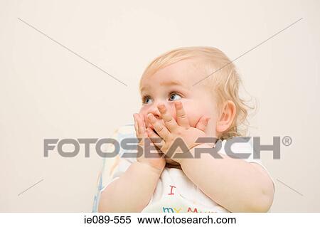 Baby boy with hands on his face View Large Photo Image Stock Photography - Baby boy with hands on his face. Fotosearch