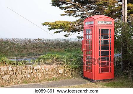 Red telephone box in rural setting View Large Photo Image Stock Image - Red telephone box in rural setting. Fotosearch