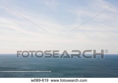 A boat on the sea View Large Photo Image Stock Photo - A boat on the sea. Fotosearch