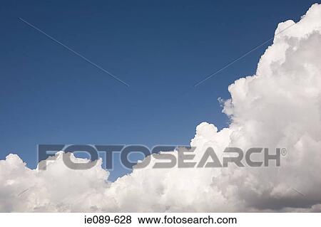 A cloud and blue sky View Large Photo Image Stock Photo - A cloud and blue sky. Fotosearch