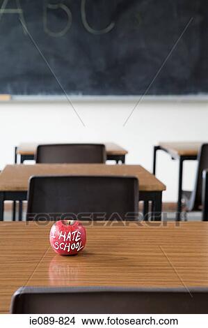 Apple on a desk View Large Photo Image Picture - Apple on a desk. Fotosearch