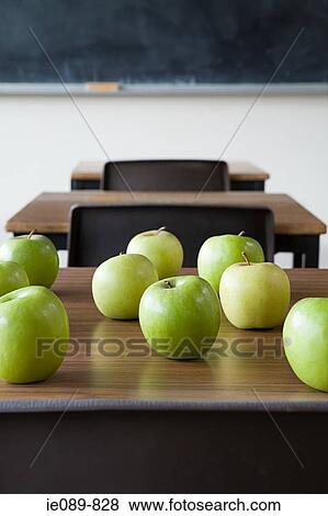 Apples on a desk View Large Photo Image Stock Photo - Apples on a desk. Fotosearch