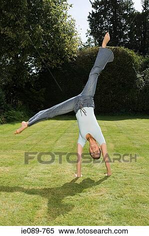 Woman cartwheeling View Large Photo Image Stock Photography - Woman cartwheeling. Fotosearch