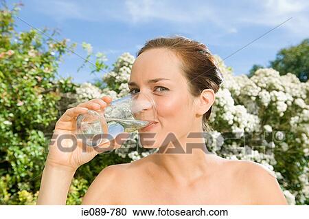 Stock Image - Woman drinking water. Fotosearch