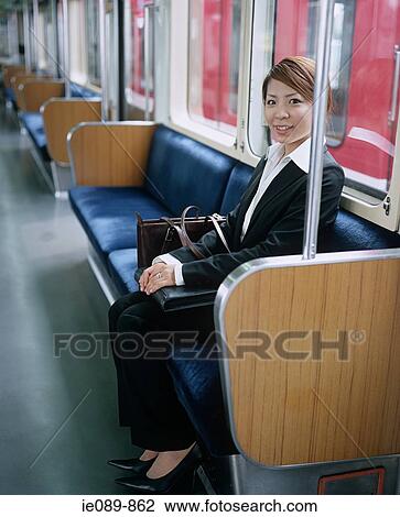 Young woman commuting View Large Photo Image Stock Image - Young woman commuting. Fotosearch