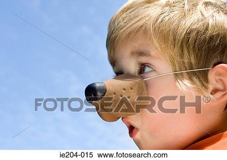 A boy wearing an animal nose View Large Photo Image Stock Photography - A boy wearing an animal nose. Fotosearch