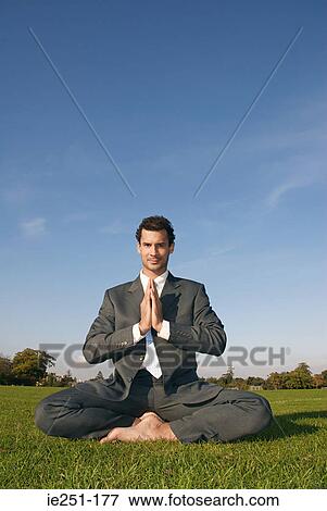 A businessman doing yoga View Large Photo Image Stock Photo - A businessman doing yoga. Fotosearch