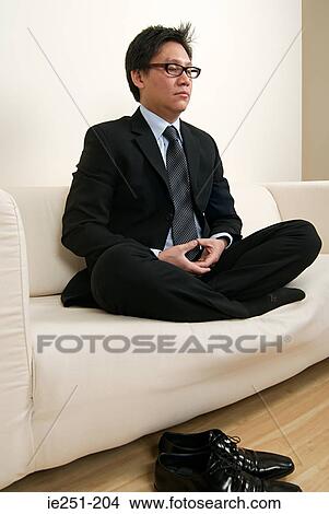 A businessman meditating View Large Photo Image Picture - A businessman meditating. Fotosearch
