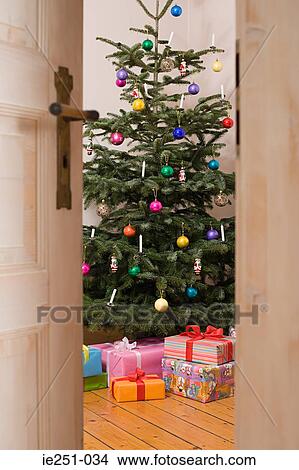 A christmas tree and presents View Large Photo Image Picture - A christmas tree and presents. Fotosearch