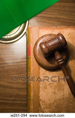 A gavel on top of a book View Large Photo Image Picture - A gavel on top of a book. Fotosearch