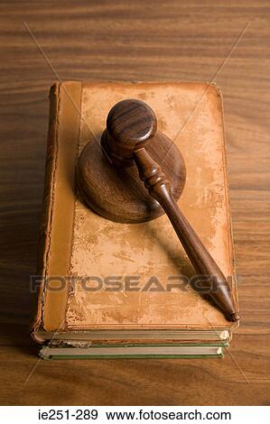 A gavel on top of books View Large Photo Image Stock Photo - A gavel on top of books. Fotosearch