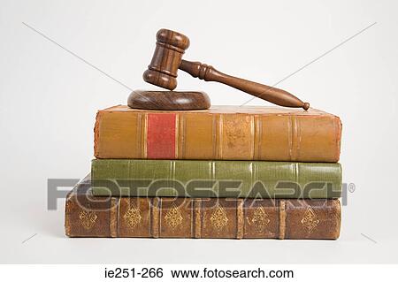 Stock Photograph - A gavel on top of books. Fotosearch