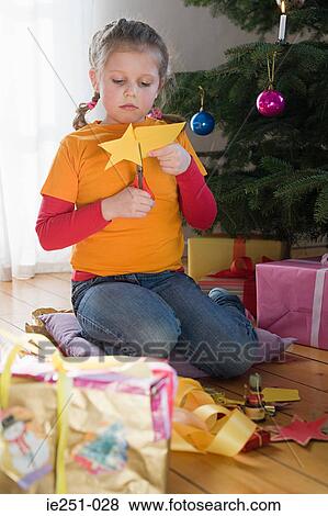 A girl cutting out a star shape View Large Photo Image Stock Photo - A girl cutting out a star shape. Fotosearch