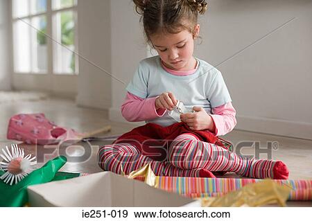 A girl holding adhesive tape View Large Photo Image Stock Photo - A girl holding adhesive tape. Fotosearch