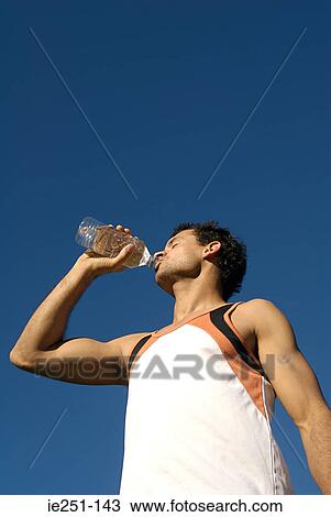 A man drinking water View Large Photo Image Stock Image - A man drinking water. Fotosearch