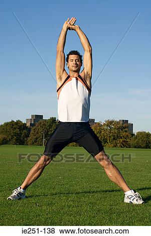 A man stretching View Large Photo Image Stock Photo - A man stretching. Fotosearch