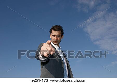 An angry businessman pointing View Large Photo Image Stock Image - An angry businessman pointing. Fotosearch