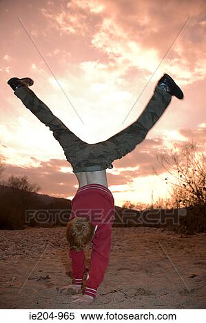 Boy doing handstand View Large Photo Image Stock Photography - Boy doing handstand. Fotosearch