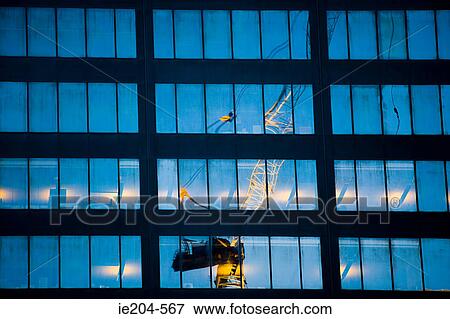 Crane reflected in windows View Large Photo Image Stock Photo - Crane reflected in windows. Fotosearch