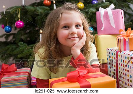Portrait of a girl with presents View Large Photo Image Stock Photography - Portrait of a girl with presents. Fotosearch