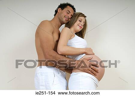 Portrait of a pregnant couple View Large Photo Image Picture - Portrait of a pregnant couple. Fotosearch