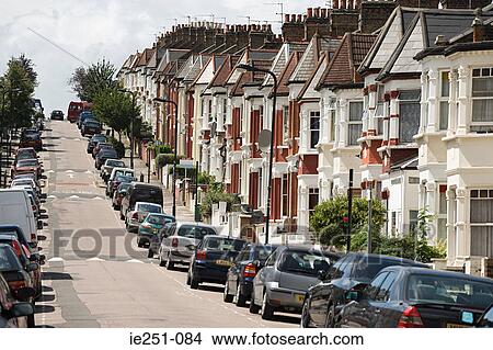 Row of terraced houses on a hill View Large Photo Image Picture - Row of terraced houses on a hill. Fotosearch