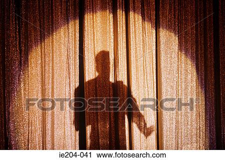 Shadow of a person on a stage curtain View Large Photo Image Stock Image - Shadow of a person on a stage curtain. Fotosearch