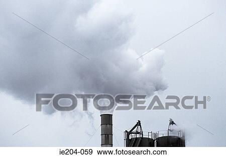 Smoke coming out of a chimney View Large Photo Image Stock Photo - Smoke coming out of a chimney. Fotosearch