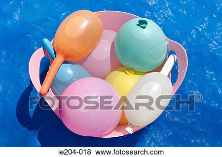 Water balloons in a basket View Large Photo Image Stock Photo - Water balloons in a basket. Fotosearch
