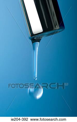 Stock Image - Water falling from a tap. Fotosearch