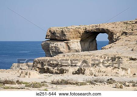 Picture - Arch in a cliff gozo malta. Fotosearch