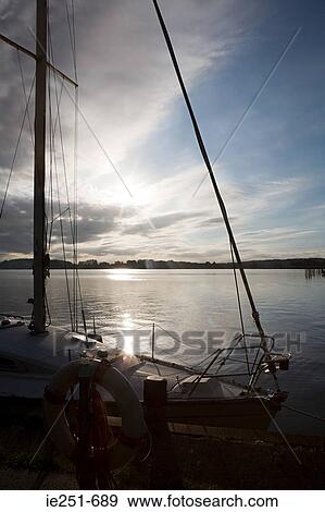 Boat at sunset View Large Photo Image Stock Photo - Boat at sunset. Fotosearch
