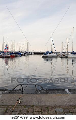 Fishing in harbour View Large Photo Image Stock Photo - Fishing in harbour. Fotosearch