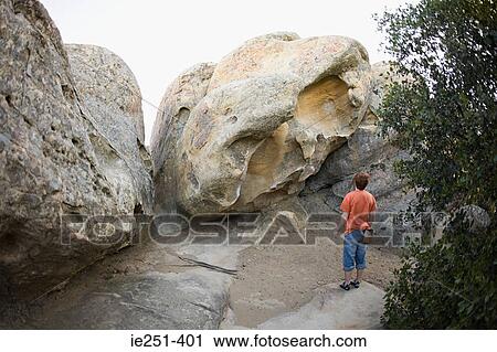 Rock climber looking at rocks View Large Photo Image Stock Image - Rock climber looking at rocks. Fotosearch