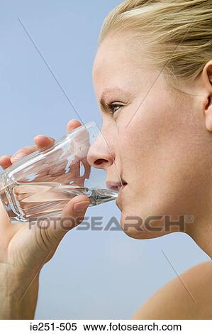 Stock Photography - Woman drinking water. Fotosearch
