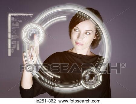 Stock Image - Woman touching screen. Fotosearch