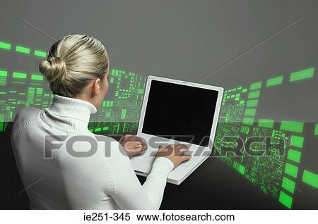 Woman using laptop View Large Photo Image Stock Photography - Woman using laptop. Fotosearch