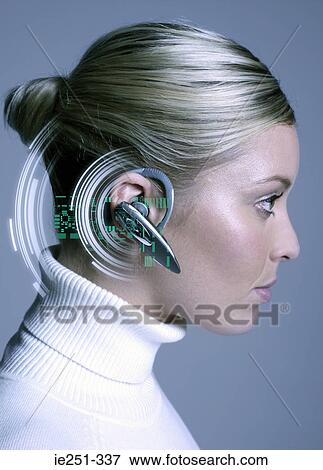 Woman wearing hands free device View Large Photo Image Stock Photo - Woman wearing hands free device. Fotosearch