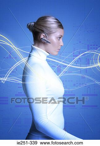 Woman wearing hands free device View Large Photo Image Stock Photo - Woman wearing hands free device. Fotosearch